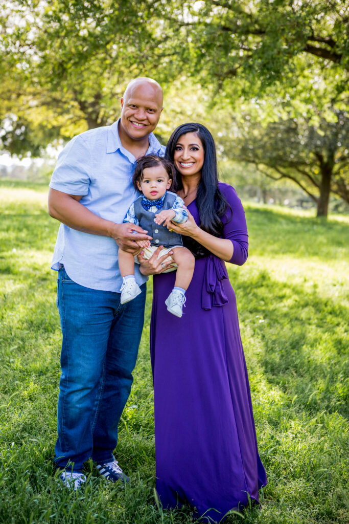 family in an outdoor setting, mother, father, baby